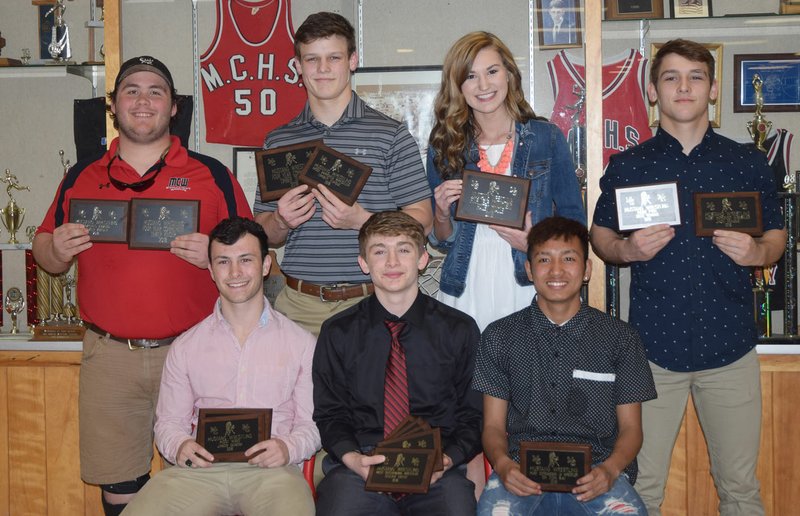 RICK PECK/SPECIAL TO MCDONALD COUNTY PRESS Awards were presented to members of the McDonald County High School wrestling team at a banquet held March 15 at MCHS. Front row, left to right: Jakob Gerow, four-year commitment and Most Wins; Oscar Ortiz, Most Outstanding Wrestler, Most Technical Falls, Most Takedowns and Quickest Pin; and Eh Doh Say, Most Outstanding JV Wrestler. Back row, Tinker Kinser, four-year commitment and Coach's Award; Timber Teague, four-year commitment and Most Improved; Hailey Knadle (manager), four-year commitment; and Jack Teague, Most Improved.