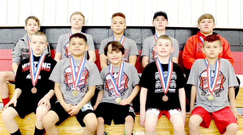 Photo Submitted McDonald County Youth Wrestling Club members are Jette Akins (front, left), Stevan Benhumea, Christian Benhumea, Landon Vick, Christopher Ramirez, Cross Spencer (back, left), Levi Smith, Trey Hardin, Colter Vick and Samuel Murphy. Not pictured are Fischer Sanny, Jayce Hitt and Ryder Martin.