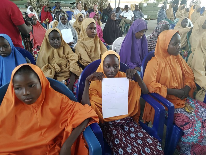 The girls from the Government Girls Science and Technical College Dapchi who were kidnapped and set free are photographed during a hand over to government officials in Maiduguri, Nigeria, Wednesday March 21, 2018. Witnesses say Boko Haram militants have returned an unknown number of the 110 girls who were abducted from their Nigeria school a month ago. 