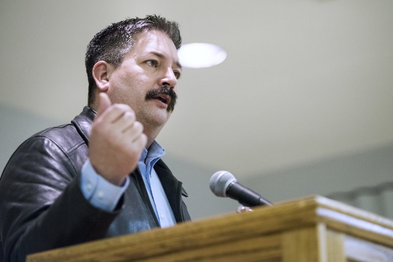 In this Feb. 8, 2018, file photo, Randy Bryce, a Democratic primary candidate for the 1st Congressional District, addresses supporters at the United Automobile Workers building in Janesville, Wis. National Democrats are endorsing ironworker Bryce in the Wisconsin congressional primary battle for the right to challenge Republican House Speaker Paul Ryan in the November midterm elections.