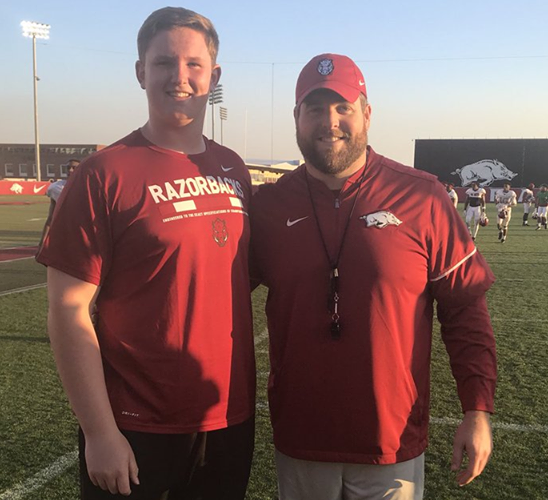 2020 offensive lineman Chad Lindberg and Arkansas offensive line coach Dustin Fry. 