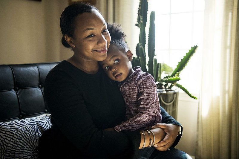 Parker Curry and her mother, Jessica Curry, at home.   