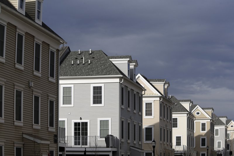 In this Feb. 26, 2018, photo new townhouses are seen in Wood-Ridge, N.J. On Thursday, March 22, Freddie Mac reports on the week&#x2019;s average U.S. mortgage rates. (AP Photo/Seth Wenig)