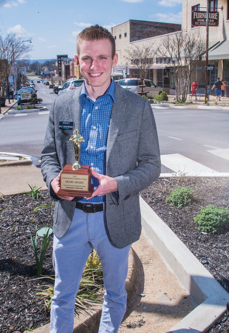 Kyle Christopher, director of tourism for the Batesville Area Chamber of Commerce, holds the Community Tourism Development Award the city received earlier this month at the Arkansas Governor’s Conference on Tourism. Christopher, who was hired in July 2016, said the honor rewarded the chamber, the city of Batesville and Main Street Batesville for their efforts to improve the community and increase tourism.