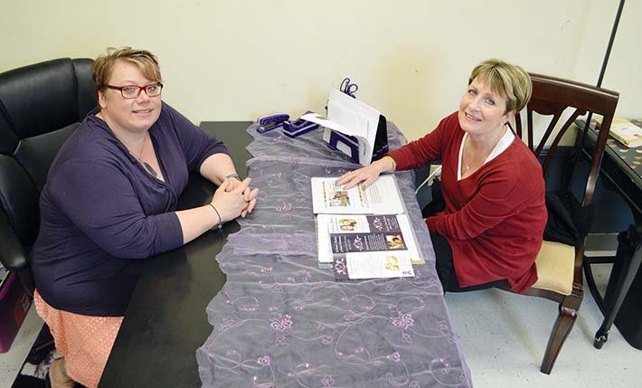 Carrie Curtis, left, executive director of the Women’s Shelter of Central Arkansas in Conway, and Debbie Honeycutt, vice president of the organization’s board of directors, discuss Risen From Silence. The third annual fundraiser is scheduled for 6 p.m. Thursday at the Knights of Columbus Hall in Conway. Tickets and sponsorships are still available by calling (501) 358-6219.