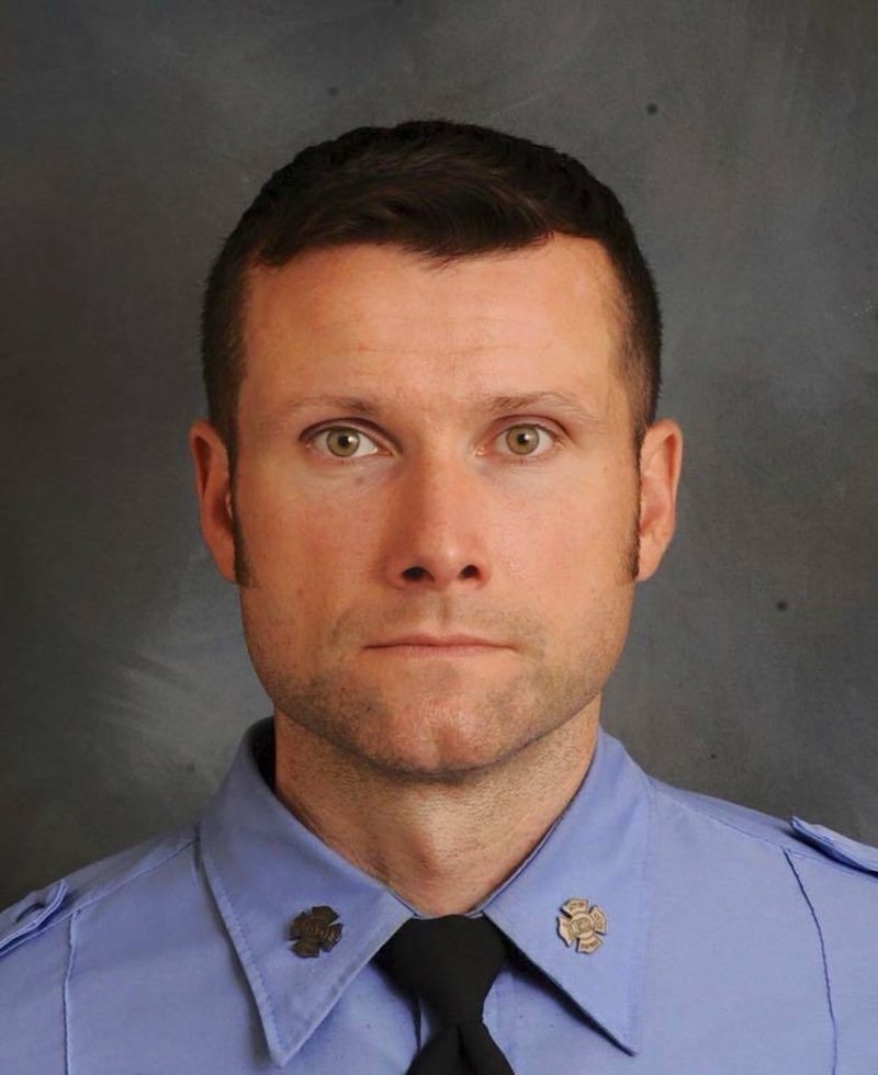 This photo provided by New York Fire Department shows FDNY Firefighter Michael R. Davidson of Engine Company 69.