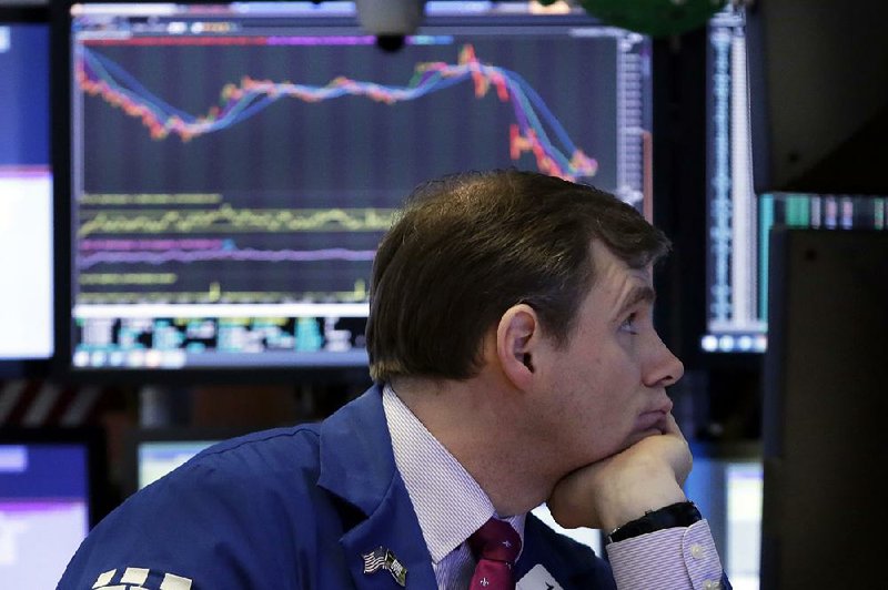 Specialist Thomas Schreck watches stock numbers plummet Thursday at the New York Stock Exchange. Stocks fell sharply and bond prices rose after the Trump administration moved to place billions of dollars worth of tariffs on some goods imported from China and restrict Chinese investments.