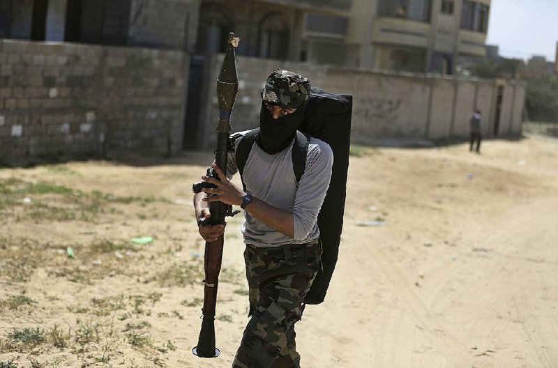 A Palestinian member of the Hamas security forces patrols during an operation Thursday to arrest suspects wanted for a roadside bombing that targeted the visiting Palestinian premier’s convoy in Gaza last week.  