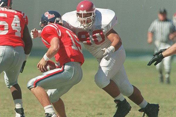 Arkansas nose guard Junior Soli sacks Ole Miss quarterback Josh Nelson during a game Saturday, Oct. 4, 1995, in Memphis, Tenn.