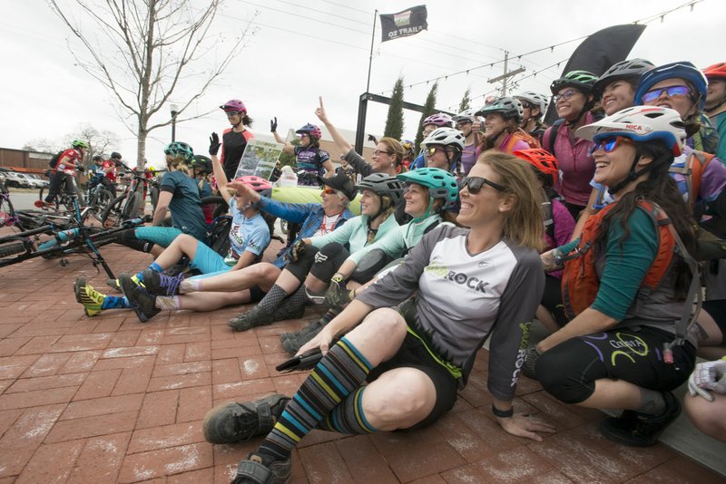 Riders take a picture before an all-women’s bike ride Friday that started at Record and ended at Slaughter Pen Trail in Bentonville. The International Mountain Bicycling Association held an event called Uprising to try and increase female participation in mountain biking.