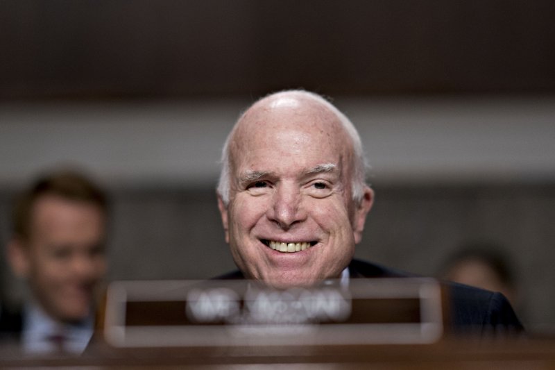 Sen. John McCain smiles during a hearing in Washington on Nov. 30, 2017. MUST CREDIT: Bloomberg photo by Andrew Harrer