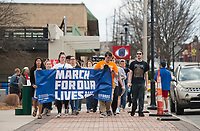 NWA Democrat-Gazette/BEN GOFF @NWABENGOFF Participants march from the Shiloh Square to South Thompson Street Saturday, March 24, 2018, during the March for our Lives event in downtown Springdale. The local march was organized by students from Springdale Har-Ber High in solidarity with marches across the country today to call for an end to gun violence.