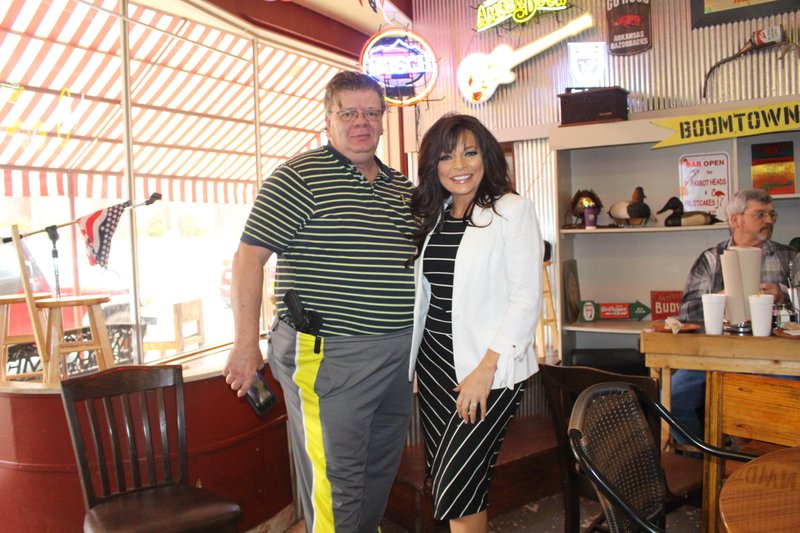 Campaign: John Wilson, president of the TEA Party Patriots of Union County, stands with Jan Morgan, Arkansas’ gubernatorial candidate challenging Gov. Asa Hutchinson. Morgan attended a meet and greet with the TEA Party Patriots of Union County at Main Street Pizza on Saturday.