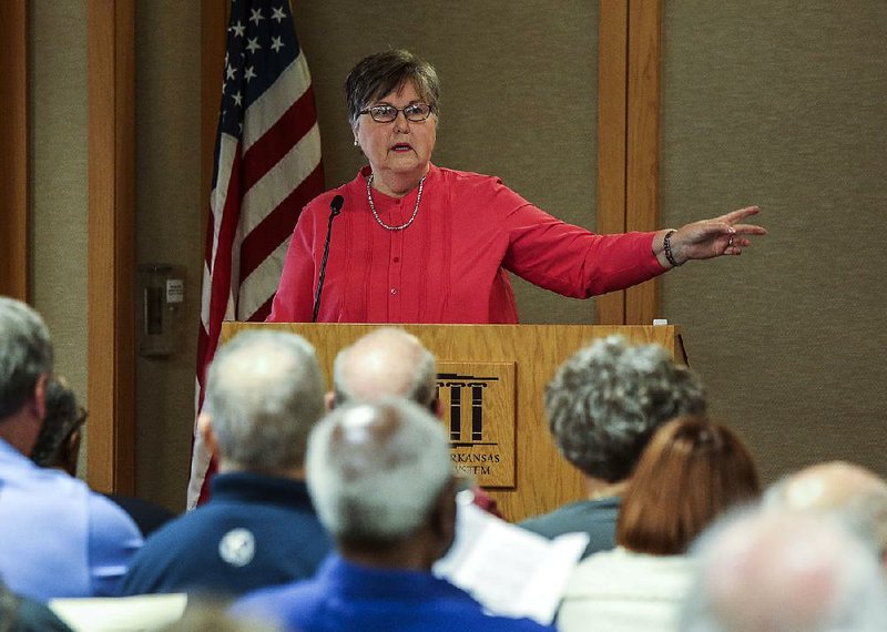 Mary Dillard, a member of the Arkansas History Commission, speaks Saturday during the Saving Our Arkansas Heritage event at the Darragh Center in the Central Arkansas Library System’s Main Library in Little Rock.
