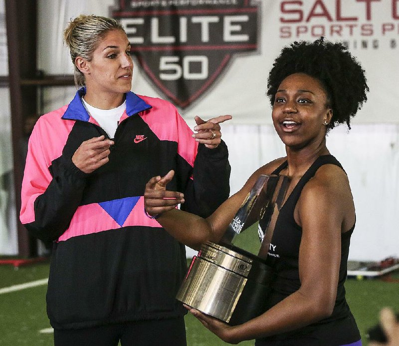 Central Arkansas Christian’s Christyn Williams (right) is presented the Gatorade National Player of the Year award by WNBA star Elena Delle Donne in Bryant on Saturday.