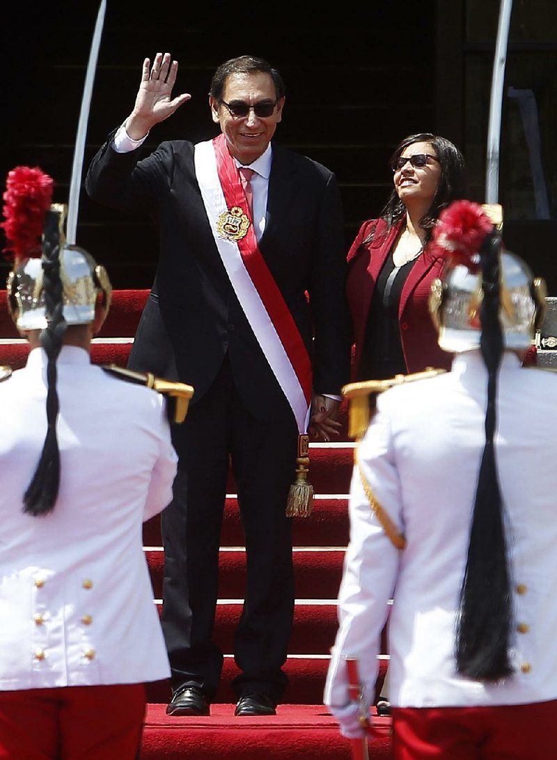 Peru’s new president, Martin Vizcarra, accompanied by his wife Maribel Diaz, arrives Friday at the House of Pizarro, the presidential residence and workplace, in Lima.