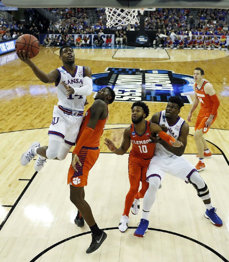 Kansas’ Malik Newman led the Jayhawks with 17 points in an 80-76 victory over the Clemson Tigers in the Midwest Regional in Omaha, Neb. The Jayhawks advanced to the regional final for the third consecutive year.
