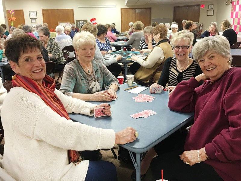 Courtesy photo Amy McGee, Roberta Dale, Debbie Sorenson and Bev Cannady enjoy the Altrusa Game Day fundraiser on March 6 at the United Lutheran Church in Bella Vista. With their focus on children's literacy, the Altrusa Club of Northwest Arkansas works hard throughout the year to put books in the hands of children. In addition to all the book distributions to Thomas Jefferson Elementary School, Northwest Arkansas Children's Shelter, Autumn's Reride and Youth Ranch, Goodman Elementary School, Laundry to Literacy, Habitat for Humanity of Benton County, One Community, the DEB Project, the Bentonville and Bella Vista libraries, the Samaritan Community Center, Gravette Middle School, New Beginnings Children's and Barbershop Books, they distributed nearly 2,000 dictionaries to third graders in Bentonville, Gravette and Pea Ridge school districts. Club meetings are held at 11:30 a.m. on the first and third Tuesdays of each month at the River Grille restaurant in Bentonville. Information: (479) 855-1250, altrusa-bb.com or facebook.com/altrusa8.