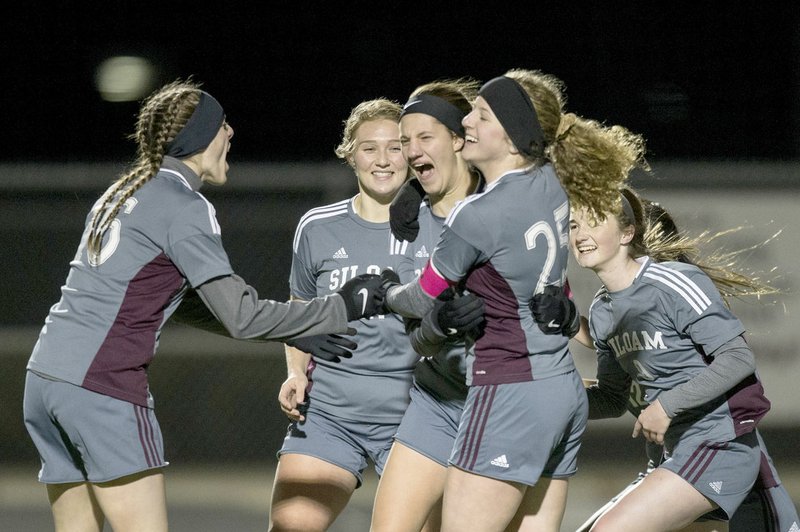 Ben Goff/NWA Democrat-Gazette Siloam Springs girls soccer players, from left, Shelby Johnson, Hailey Dorsey, Meghan Kennedy, Megan Hutto and Jaleigh Harp of Siloam Springs celebrate after scoring a goal against Rogers on March 6. The Lady Panthers (7-2-2) return to action Monday at Grove, Okla., before coming back home Tuesday against Harrison in a 5A/6A District 1 game.