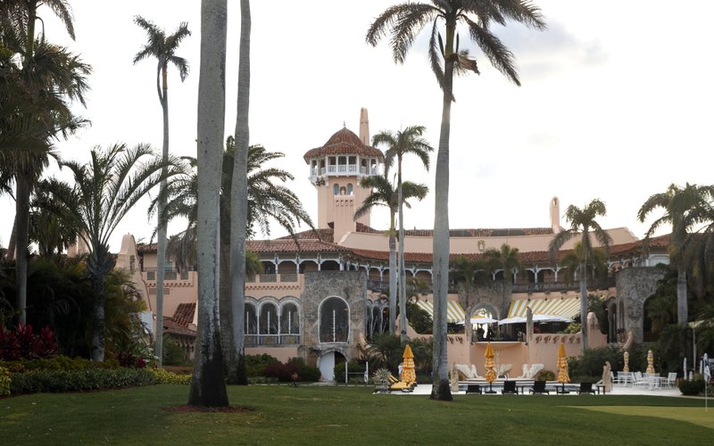 President Donald Trump's Mar-a-Lago estate is seen from the media van in the presidential motorcade in Palm Beach, Fla., Saturday, March 24, 2018, en route to Trump International Golf Club in West Palm Beach, Fla. (AP Photo/Carolyn Kaster)