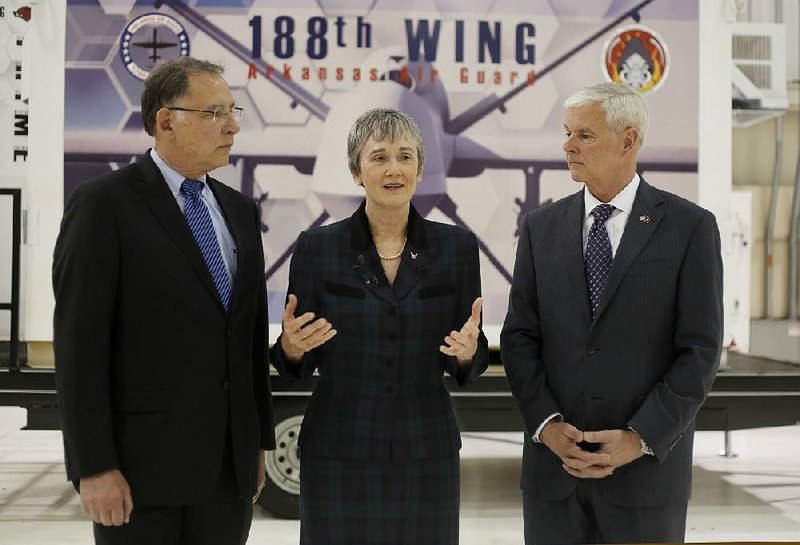 Secretary of the Air Force Heather Wilson (center) speaks Monday after visiting the 188th Wing at Ebbing Air National Guard Base in Fort Smith. Wilson, Sen. John Boozman (left) and Congressman Steve Womack toured the facility.  