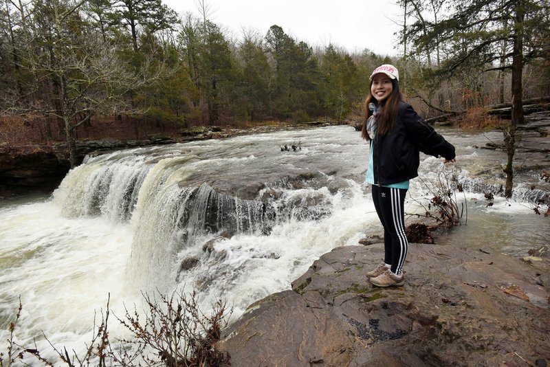 NWA Democrat-Gazette/FLIP PUTTHOFF Thao Nguyen of Fayetteville admires Falling Water Falls, along Falling Water Creek in the Ozark National Forest.