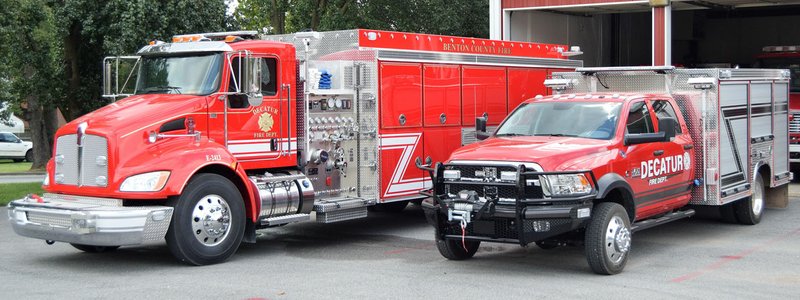 Westside Eagle Observer/MIKE ECKELS Decatur Fire Department's new fire units were parked at Station One in Decatur Sept. 9, 2016, awaiting a call. With these units and upgrades to the fire system, Decatur resident should see lower insurance bills.