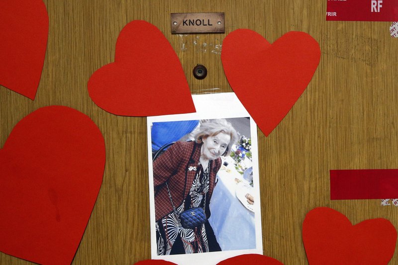 The Associated Press LOVE FOR KNOLL: View of the apartment door of Mireille Knoll, 85, who was was slain last week, Tuesday in Paris, France. Police seals, hearts and a photo of her are pasted on her entry way. Knoll had been stabbed several times and her apartment set on fire. Two suspects have been given preliminary charges of murder with anti-Semitic motives over the death of an elderly Jewish woman, a French judicial official said Tuesday.