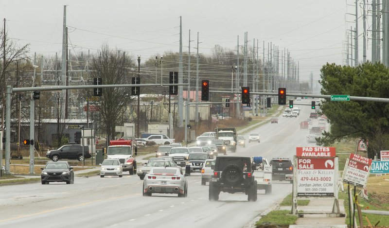 NWA Democrat-Gazette/BEN GOFF  @NWABENGOFF Traffic flows Tuesday on East Centerton Boulevard at the intersection with Greenhouse Road in Centerton. Arkansas is studying possible improvements to the Arkansas 102/U.S. 62 corridor through Benton County.