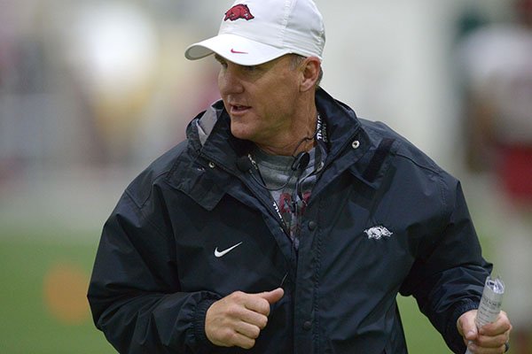 Arkansas coach Chad Morris speaks with players Wednesday, March 28, 2018, during practice at the university's practice facility on campus in Fayetteville. 