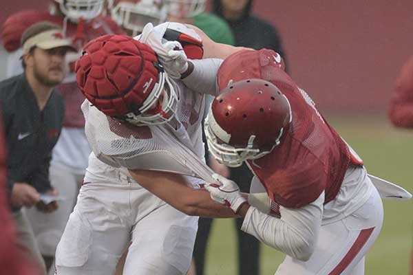 Arkansas players go through drills during spring practice Wednesday, March 28, 2018, in Fayetteville. 