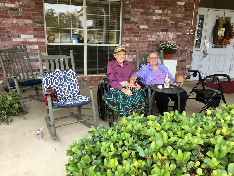Courtesy photo Marlin and Elsie Scott, who have been married for 79 years, sit together on the porch of the nursing home where Marlin lives at Mountain Home. Elsie visits her husband a few times each week.