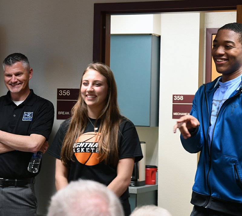 The Sentinel-Record/Grace Brown MAKING THE JUMP: From left, National Park College men's basketball team head coach Jason Hudnell, women's team leading scorer Faith Bratton and men's team leading scorer Braylon Steen addressed the NPC Board of Trustees Wednesday during their monthly meeting in the Gerald Fisher Campus Center. The board approved the college's membership to the NJCAA after one season of competing in basketball at the club level.