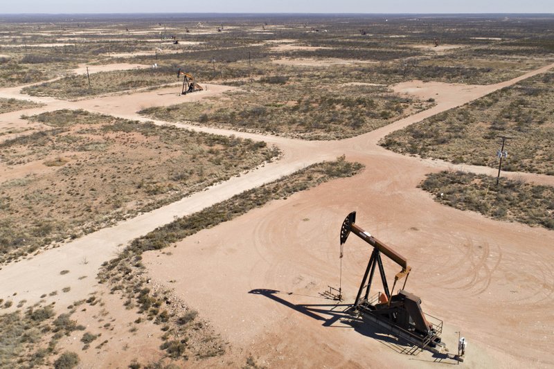 Pumpjacks operate on oil wells in the Permian Basin in this aerial photograph taken over Crane, Texas, on March 2, 2018. 