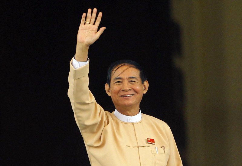 Win Myint, newly elected president of Myanmar, waves to media outside the parliament in Naypyitaw, Myanmar, in Naypyitaw, Myanmar, Wednesday, March 28, 2018. Myanmar's parliament has elected Win Myint, a loyalist of Aung San Suu Kyi, as new president. Suu Kyi, who formal title is state counsellor, has retained her executive authority over the government. (AP Photo/Aung Shine Oo)