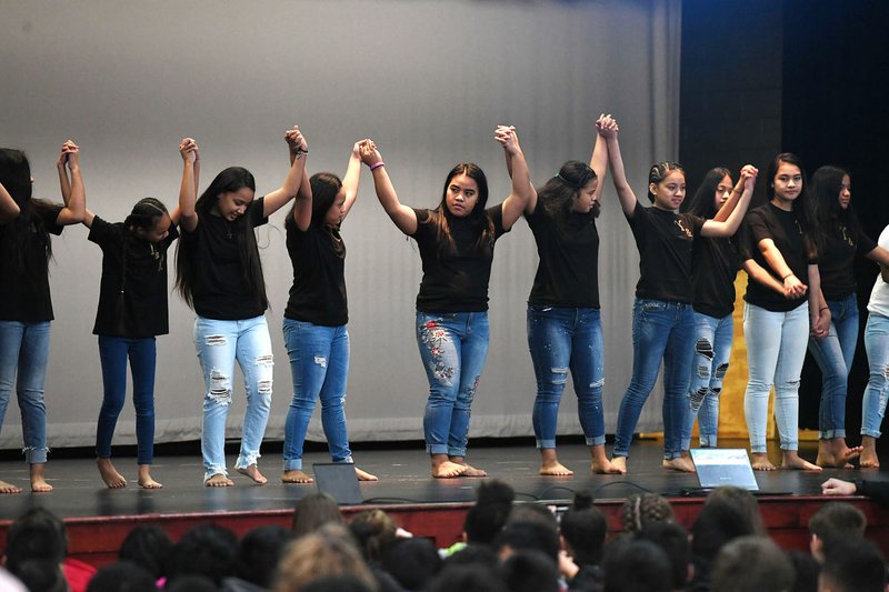 NWA Democrat-Gazette/J.T. WAMPLER Sonora Middle School's Island Girls dance group takes a bow Thursday during an assembly celebrating being named an Arkansas Diamond School to Watch. Schools are recognized with this honor based on their record of academic excellence, developmental responsibility to students and social equity. Springdale has four of the 12 schools in Arkansas with the distinction.