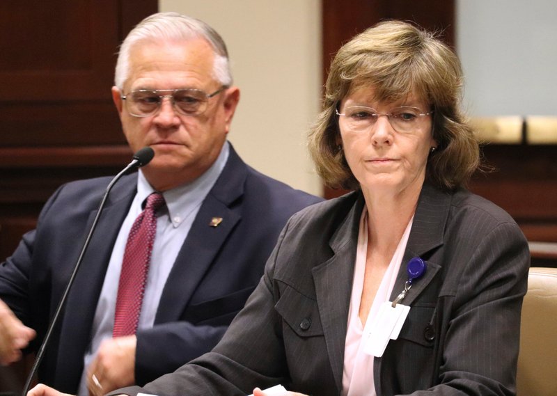 In an October 2017 file photo, Arkansas Department of Correction Director Wendy Kelley, right, testifies before legislators at the state Capitol complex in Little Rock with deputy director Dale Reed at her side. The Arkansas Supreme Court ruled Thursday that Kelley’s agency must identify the companies that manufacture Arkansas’ execution drugs but that information that identifies the middlemen can be withheld. (AP Photo/Kelly P. Kissel, File)