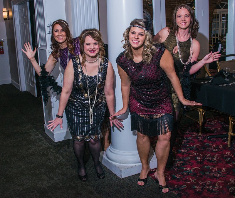 Making plans for the Junior Auxiliary of Searcy 2018 Charity Ball are, from left, Carolyn Nunnally, Natalie Horton, Megan White and Meredith Law, who are dressed appropriately for the event’s theme: The Roaring 20s. The fundraising ball will be at 7 p.m. April 14 at the Searcy Country Club.