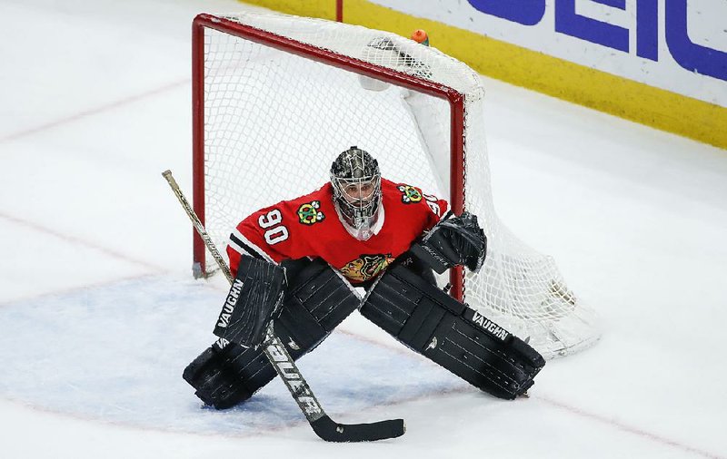 Chicago Blackhawks goalie Scott Foster defends against the Winnipeg Jets during the third period of an NHL hockey game Thursday in Chicago.  