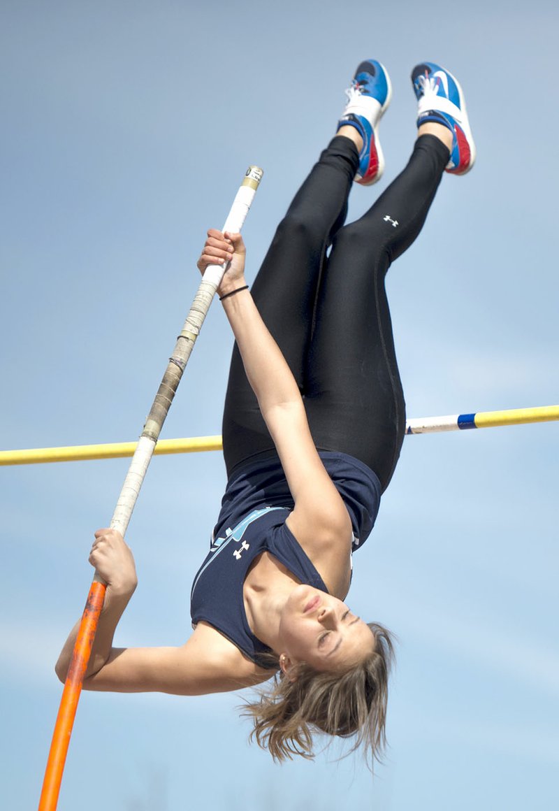 NWA Democrat-Gazette/CHARLIE KAIJO Lucy Lisle of Springdale Har-Ber pole vaults Friday during the Bentonville Border Clash track meet at the Tiger Athletic Complex in Bentonville.