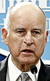 California Gov. Jerry Brown, left, accompanied by California Attorney General Xavier Becerra, listens to a question concerning remarks made U.S. Attorney General Jeff Sessions, Wednesday, March 7, 2018, in Sacramento, Calif. 