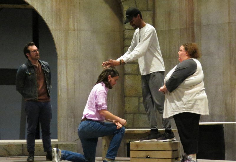 Chandler Reid Evans, John Lackey, kneeling, described as “a wonderful young bass-baritone,” Jordan Brown and Jennifer Nesbitt rehearse for “Man of La Mancha,” a collaboration between the University of Arkansas theater and music departments.