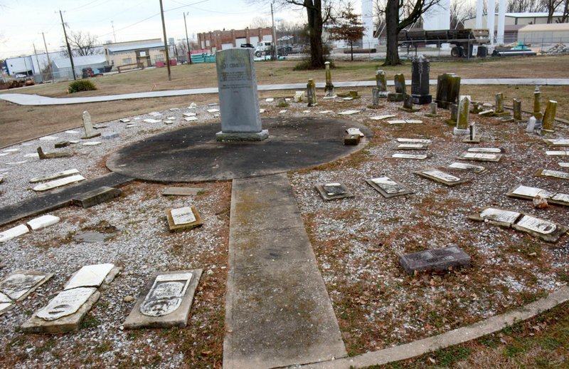 Special to NWA Democrat-Gazette/MIKE CAPSHAW The path of the trail cuts through where the tombstones that were moved once marked the graves of Siloam Springs' founders and early settlers.