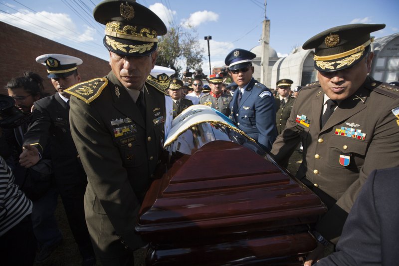 Guatemalan Army officers carry the coffin of late dictator Efrain Rios Montt before his burial at a cemetery of Guatemala City, Sunday, April 1, 2018. (AP Photo/Moises Castillo)