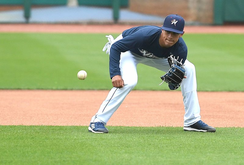 NWA Democrat-Gazette/J.T. WAMPLER Naturals' infielder Nicky Lopez Monday fields a grounder Monday during media day at Arrest Ballpark in Springdale.