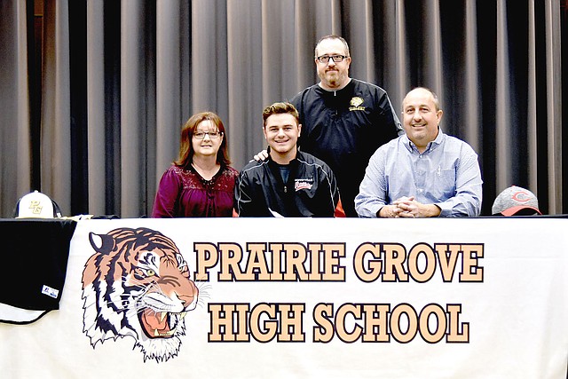 Shelley Williams Special to the Enterprise-Leader Prairie Grove junior Chase Wade recently signed a National letter of intent to play men's college baseball for Coffeyville Community College of Coffeyville, Kan. Wade was accompanied by his parents, Carol (left) and Dwane Wade, and Prairie Grove baseball coach Chris Mileham.
