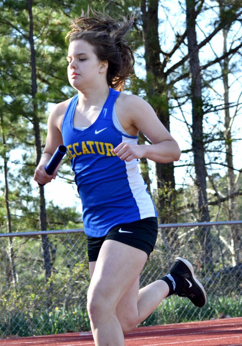 Westside Eagle Observer/MIKE ECKELS Decatur's Abby Tilley begins her second lap of the girls' 4x800 meter relay during the Cornerstone Bank Invitational Relays March 30 at Highlander Track complex Eureka Springs. Tilley and her teammates Deysi Rubi, Stephanie Sandoval and Leticia Fuentes took first place in this event which contributed to the Lady Bulldogs winning the meet.
