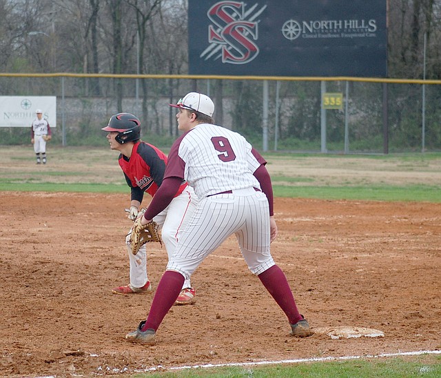 Graham Thomas/Herald-Leader Siloam Springs third baseman Dalton Cook holds on a Russellville runner during the fifth inning of Monday's game at James Butts Baseball Park. Russellville defeated the Panthers 5-1.