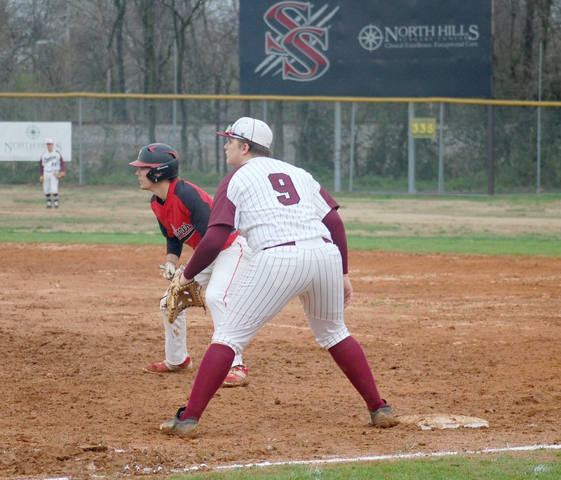 Graham Thomas/Herald-Leader Siloam Springs third baseman Dalton Cook holds on a Russellville runner during the fifth inning of Monday's game at James Butts Baseball Park. Russellville defeated the Panthers 5-1.