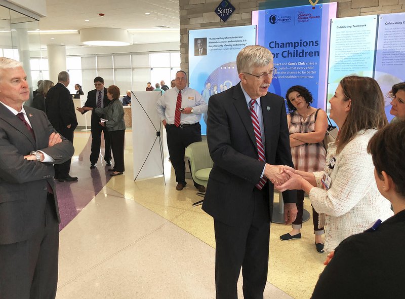 NWA Democrat-Gazette/DAN HOLTMEYER Dr. Francis Collins (center), director of the National Institutes of Health, speaks Tuesday with Arkansas Children's Northwest hospital staff members and other residents during a visit to the hospital and other Northwest Arkansas locations. Third District Rep. Steve Womack (left), a Republican from Rogers, said he asked the director to visit his district.